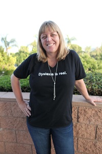 Kelli Sandman-Hurley, wearing a shirt that says Dyslexia is real