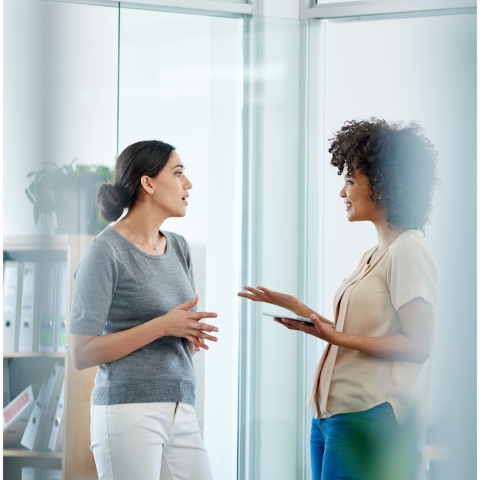 two women facing each other having a discussion