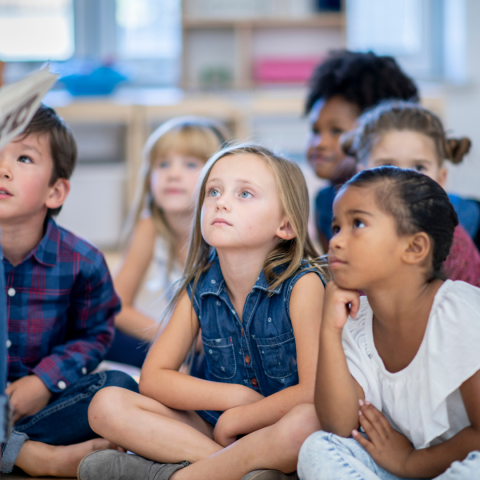 children listening to a story at the library