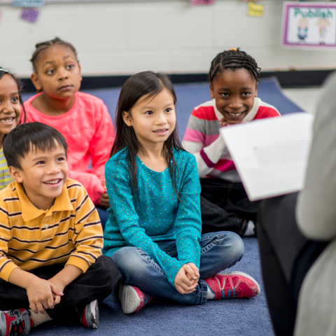 children listening to a story at the library