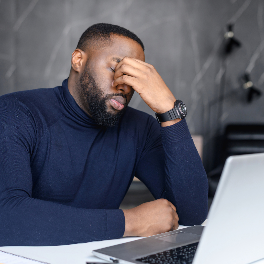 man with hand on face looking frustrated